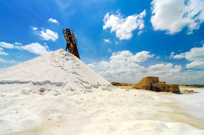 Heap of salt against blue sky