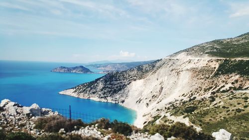 Panoramic view of sea and mountains against sky