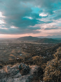 Scenic view of dramatic landscape against sky during sunset