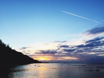 Scenic view of sea against sky at sunset