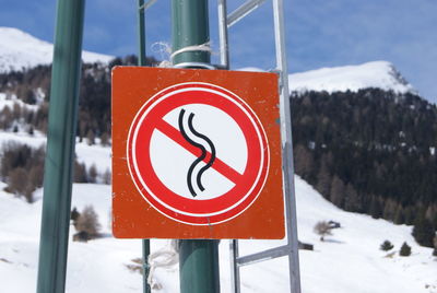 Close-up of road sign on snow