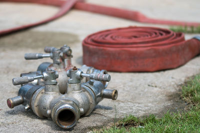 Close-up of machine part on field