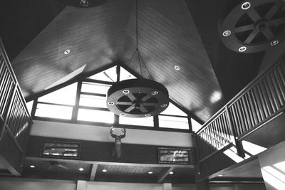 Low angle view of clock hanging on ceiling