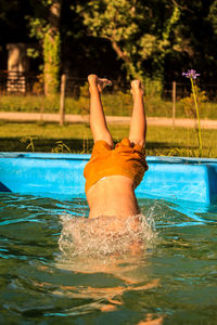 Woman relaxing in swimming pool