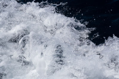 High angle view of water splashing in sea