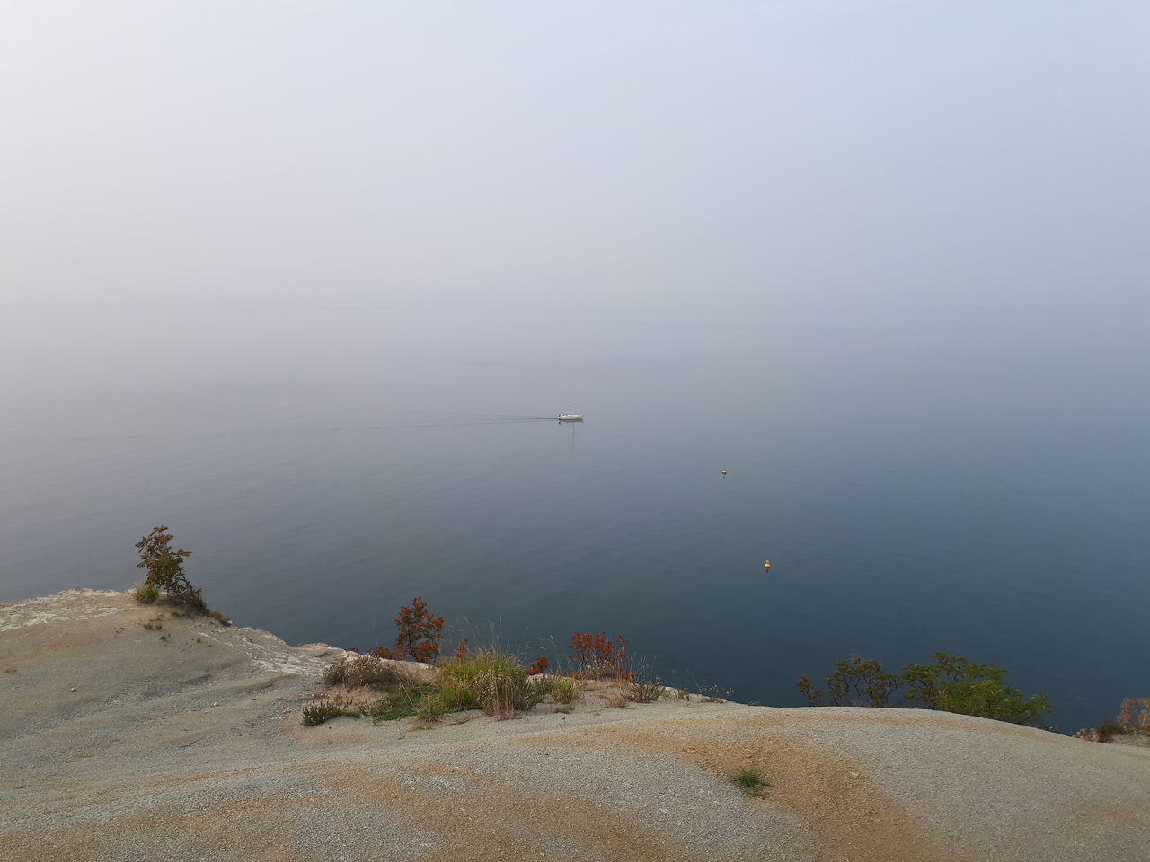 water, beauty in nature, scenics - nature, tranquility, tranquil scene, sea, sky, no people, day, beach, nature, land, fog, non-urban scene, idyllic, outdoors, copy space, high angle view