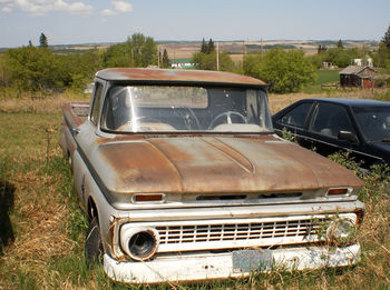 Abandoned car on land