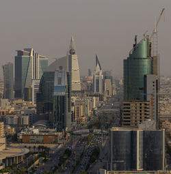 Modern buildings in city against sky