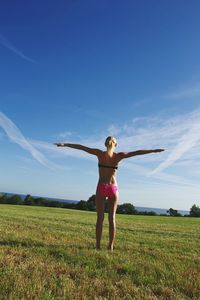 Full length of woman standing on field