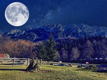 Scenic view of mountains against clear sky at night