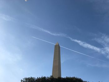 Low angle view of windmill against cloudy sky