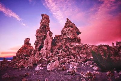 Low angle view of rock formation against sky