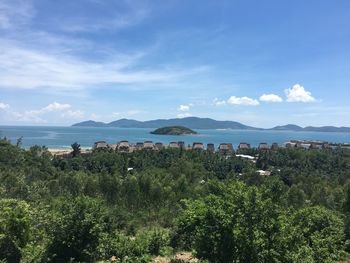 Scenic view of sea and buildings against sky