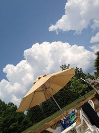 Low angle view of amusement park against sky