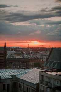 Townscape against sky during sunset