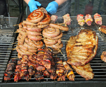High angle view of meat on barbecue grill