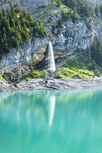 Water flowing through rocks in swimming pool