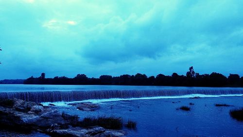 Scenic view of lake against blue sky