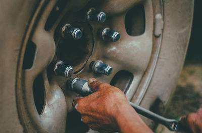 Close-up of man working in machine