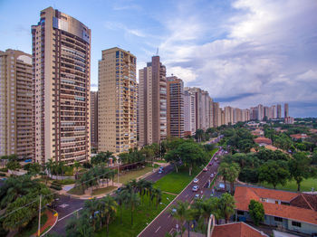 Modern buildings in city against sky