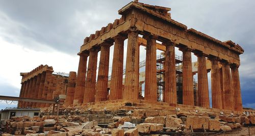 Low angle view of old temple against sky