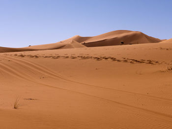 Scenic view of desert against clear sky