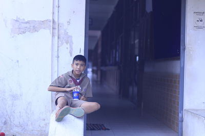 Portrait of school boy sitting in school