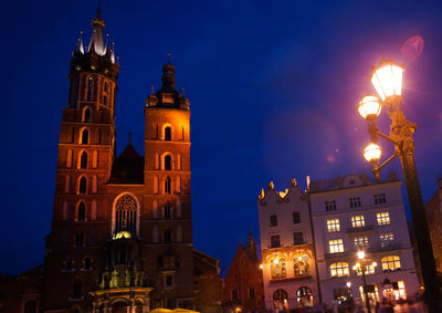 Low angle view of illuminated buildings at night