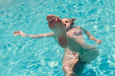 High angle view of woman swimming in pool