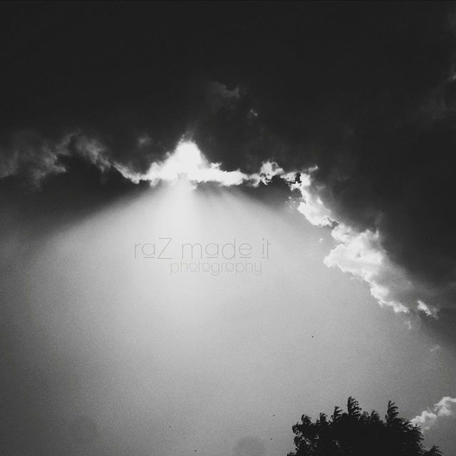 sky, text, low angle view, cloud - sky, western script, communication, cloudy, nature, tranquility, silhouette, beauty in nature, scenics, cloud, no people, outdoors, tree, tranquil scene, sunset, dusk, weather