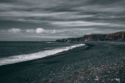 Scenic view of beach against sky