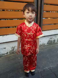 Full length portrait of boy wearing traditional clothing
