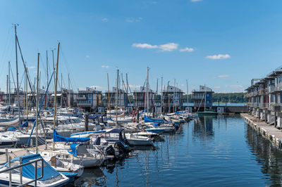 Boats moored at harbor