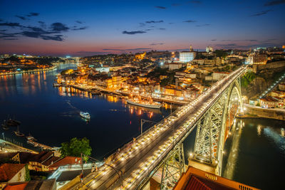 High angle view of illuminated buildings in city at night
