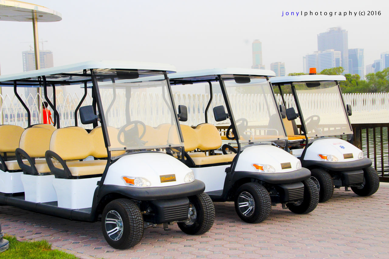 mode of transport, land vehicle, parked, stationary, architecture, built structure, parking, day, no people, absence, parking lot, outdoors, empty, side by side