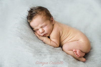 Cute baby sleeping on bed