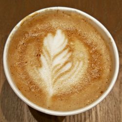 Close-up of cappuccino on table