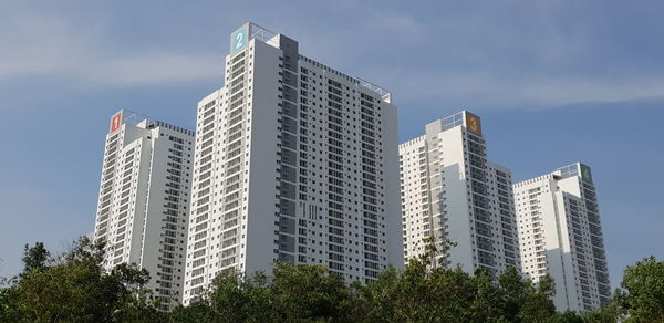 Low angle view of modern buildings against sky