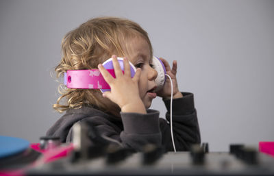 Portrait of woman with arms raised