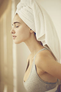 Side view of young woman looking away