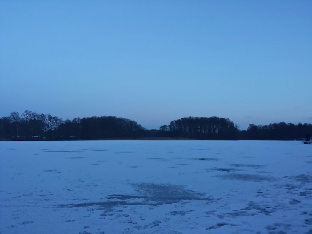 copy space, nature, tranquility, tranquil scene, tree, blue, beauty in nature, clear sky, scenics, no people, water, outdoors, snow, day, lake, landscape, sky, cold temperature, frozen lake