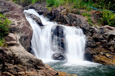 Scenic view of waterfall in forest