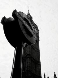 Low angle view of clock tower against sky