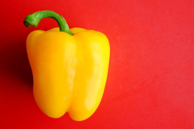 Close-up of bell peppers against red background