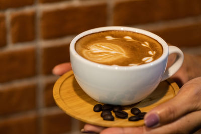 Close-up of coffee cup on table