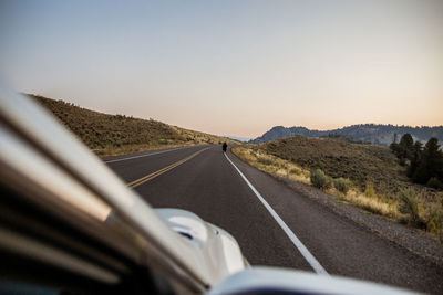 Road amidst landscape against clear sky