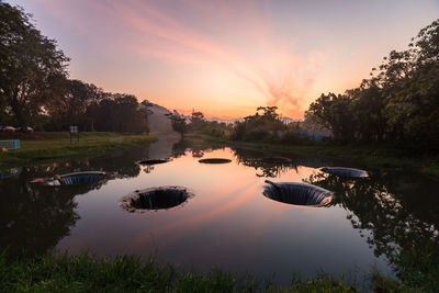 Scenic view of lake against sky during sunset