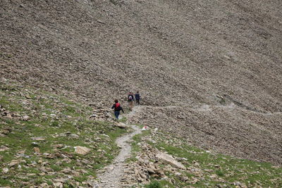 High angle view of family hiking on mountain