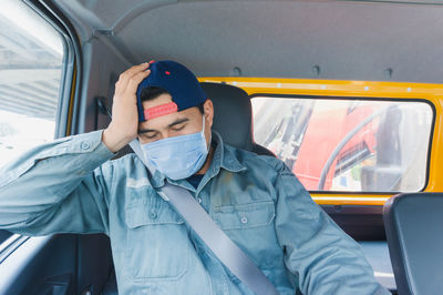 Man sitting in car