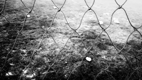 Close-up of fence on field